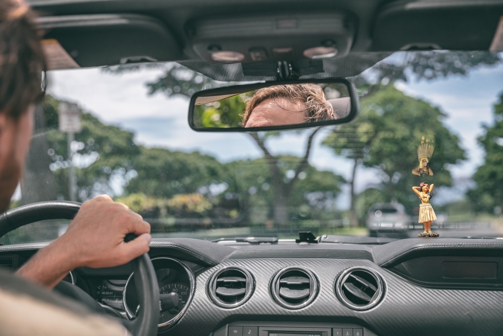 Man Driving in a rental car in Maui