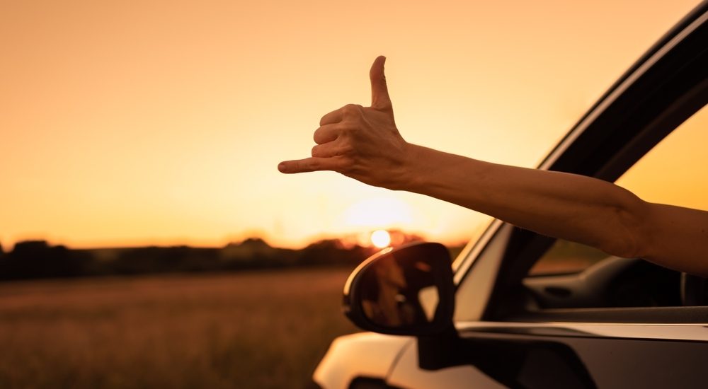 Arm sticking out of rental car in Maui
