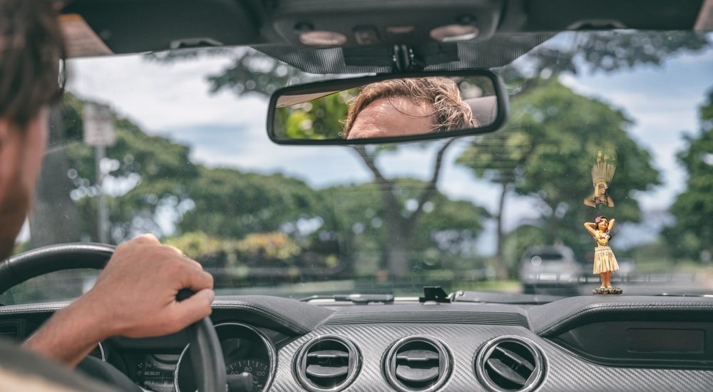 Man Driving in a rental car in Maui